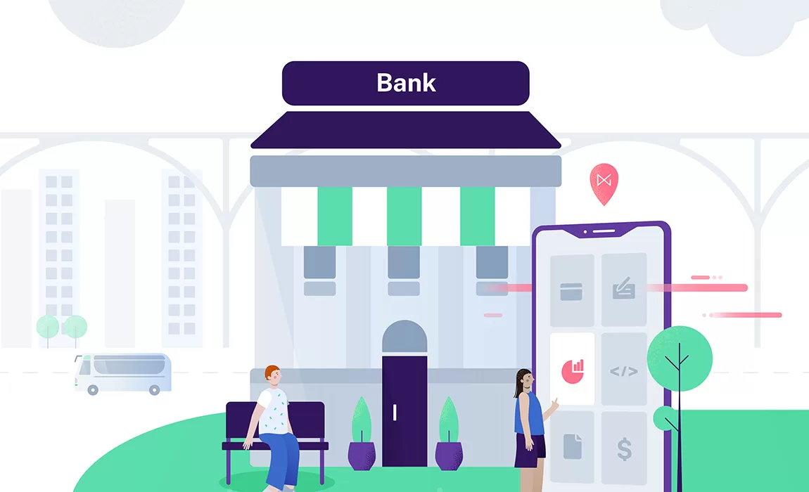 A bank with a man sitting on a bench infront of it with a woman to the side navigating an oversized cellphone.