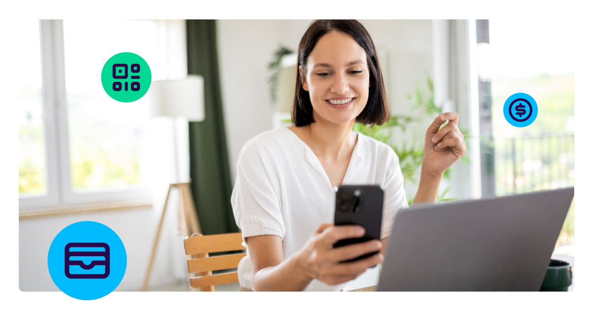 Image of woman using apple pay using a QR code on her desktop