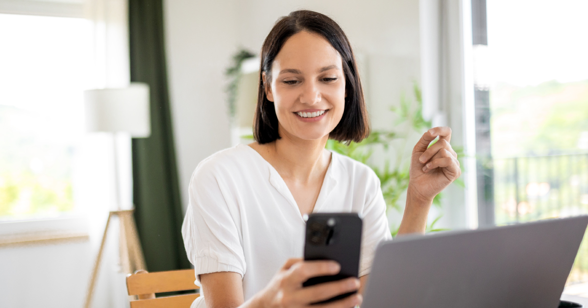 Image of woman using apple pay using a QR code on her desktop
