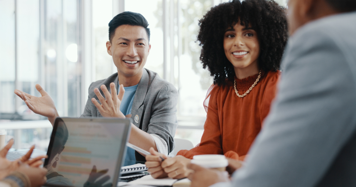 Image of a group of people talking about how the reseller model works in the payments industry.