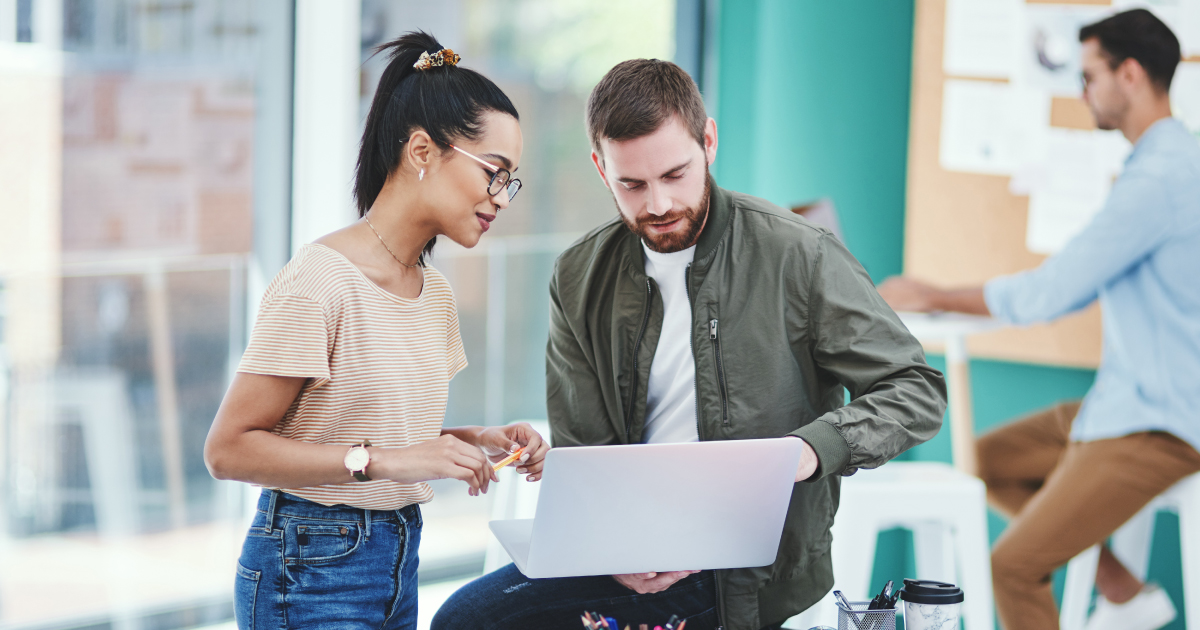 Image of a man and woman who run an ISO payments company. They're discussing the 5 ways to compete with bigger payment platforms.