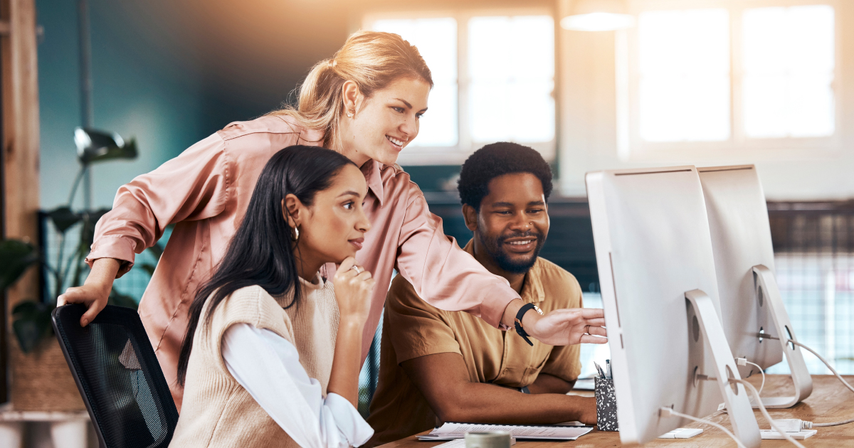 Image of payments company employees discussing how to use AI and build an AI-first product org