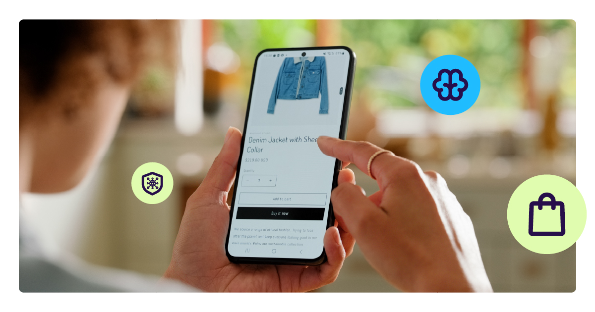 Person using a smartphone to shop online for a denim jacket, illustrating the concept of AI-powered agentic commerce and autonomous digital payments.