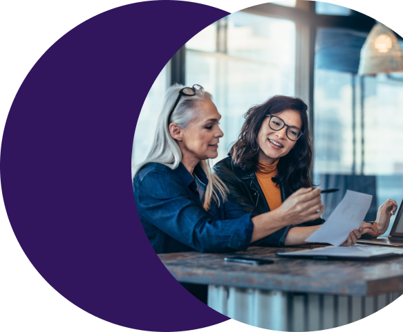 image (built to scale with your operations) Two payments professionals reviewing merchant boarding workflows on a laptop, using Merchant Central to manage high-volume merchant applications without increasing operational complexity.