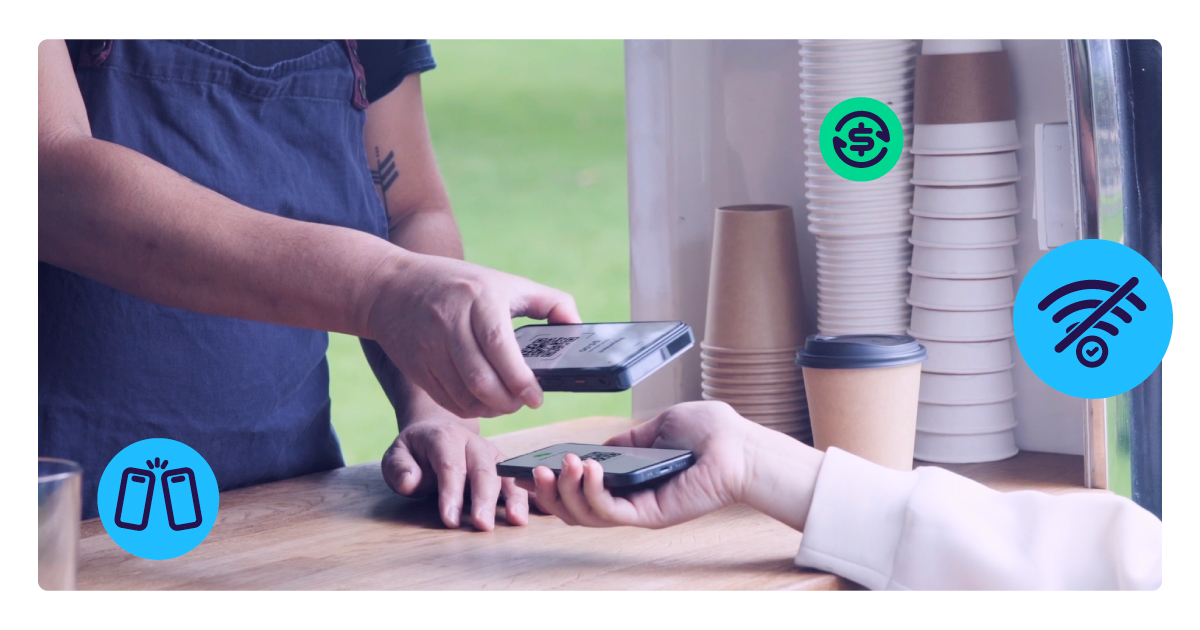 A mobile coffee cart takes a contactless payment from a customer's phone.
